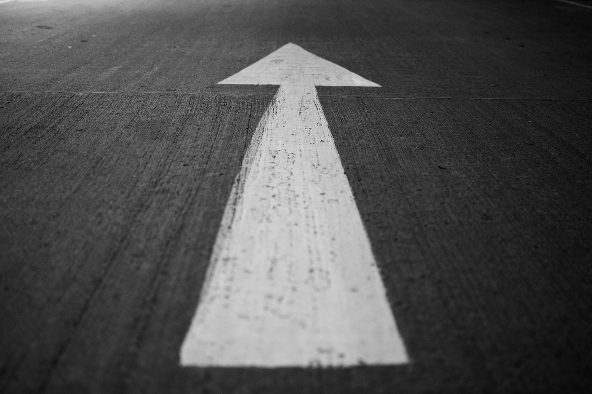 An arrow upward showing the momentum that executive coaching from Deepklar brings.